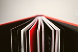 a close up of an open book on a table.