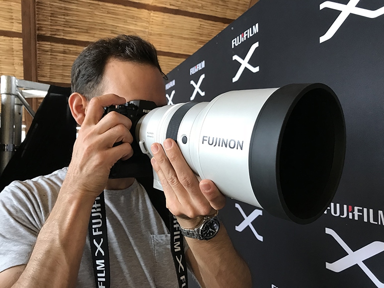 man uses most expensive fuji lens