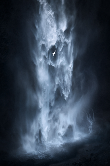 An image of a waterfall in the dark.