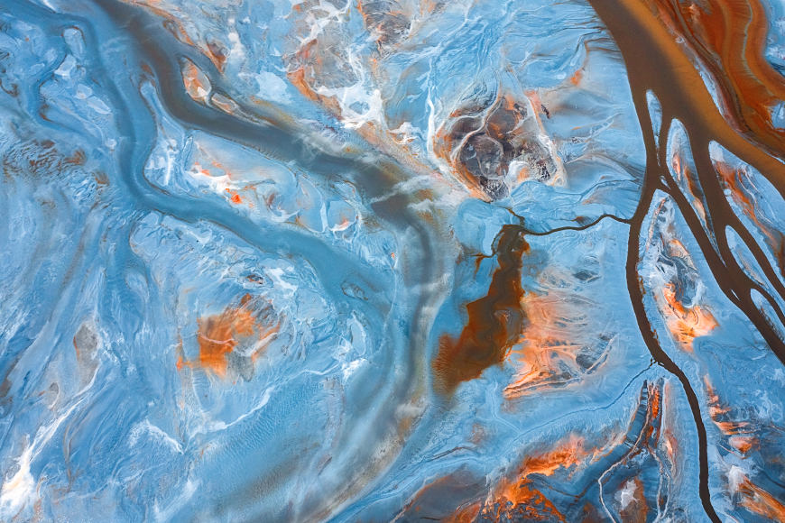 An abstract image of blue and orange liquids.