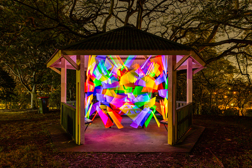 A gazebo with colorful lights.