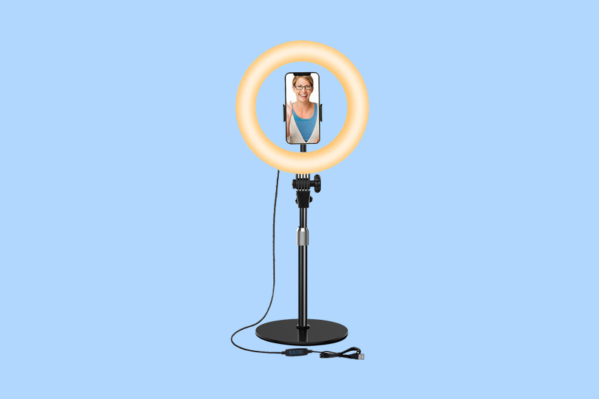 A ring light with a woman's face on it.