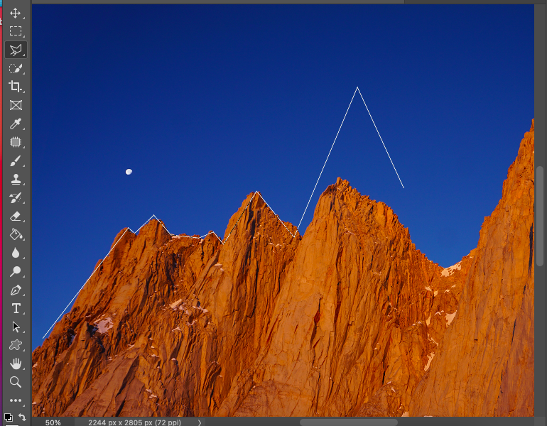 A photo of a mountain in adobe photoshop.